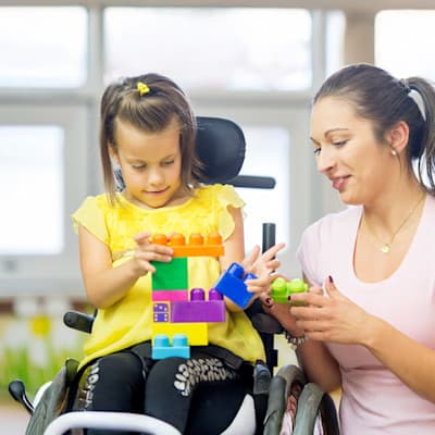 Mom and child playing with building blocks.