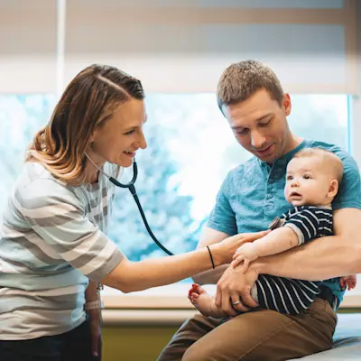 Children's Physician's primary care provider performing an exam on a child.
