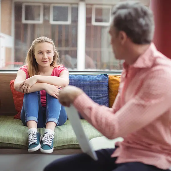 Teen talking to adult.