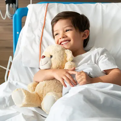 Young patient receiving dialysis treatment.