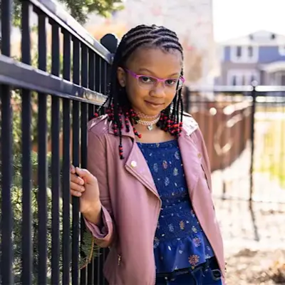 Angelina smiling while playing outside.
