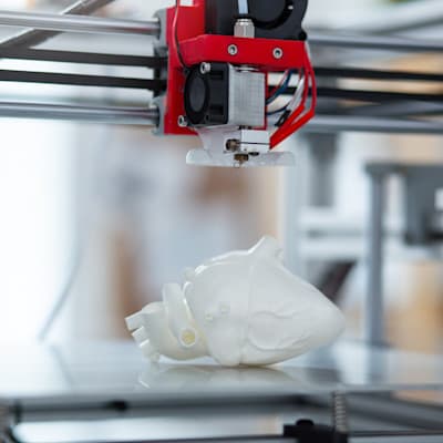 Using technology to 3D print a heart.