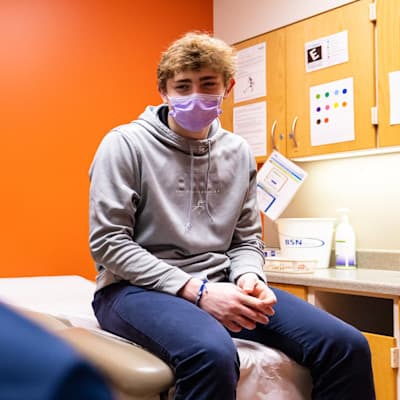 Michael speaking with his sports medicine provider.