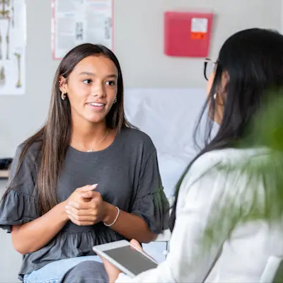 Teen girl talking to provider.