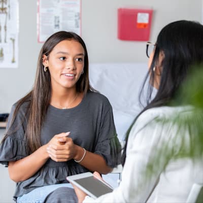 Teen girl talking to provider.