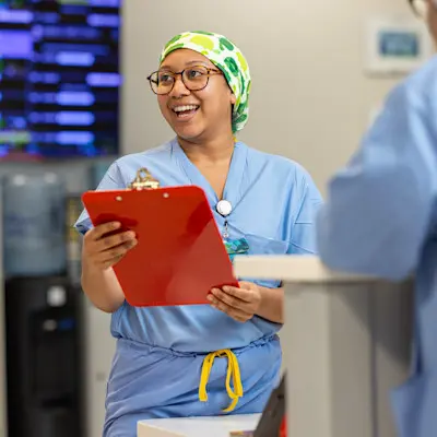 Children's provider's talking on patient floor.