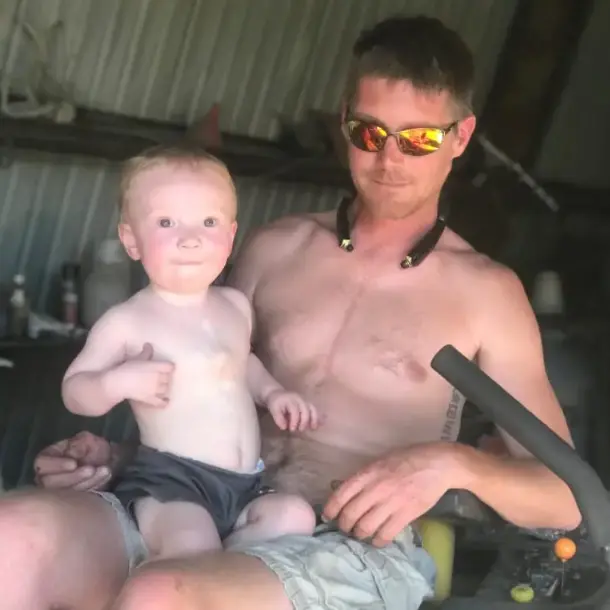 Jake holding his son, Kash.