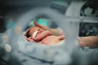 Infant patient in the neonatal intensive care unit.