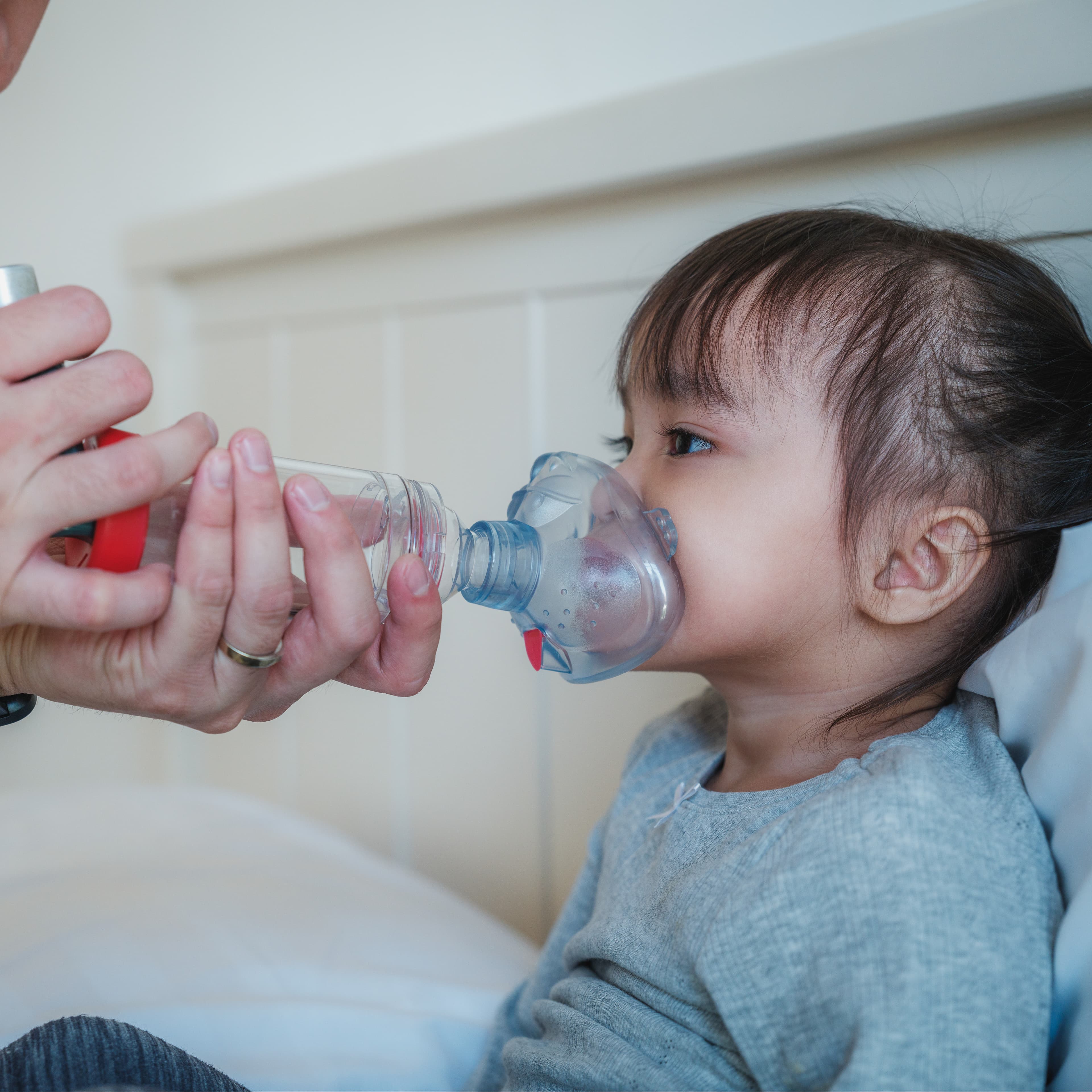 Young child with an inhaler.