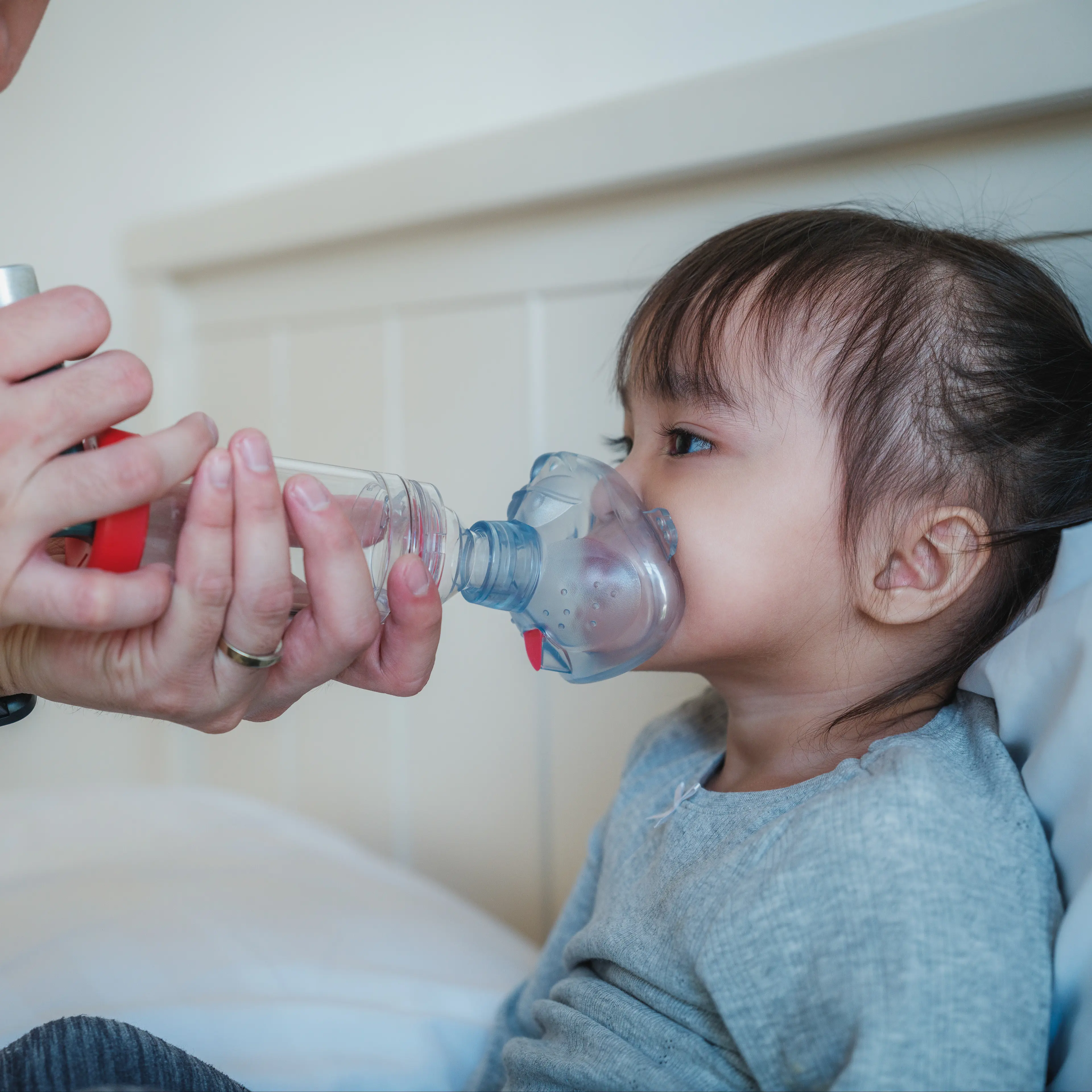Young child with an inhaler.