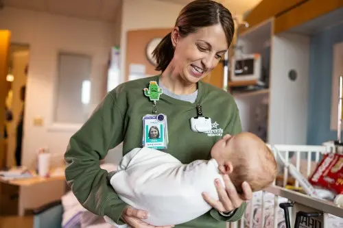 nurse with baby at Children's Nebraska