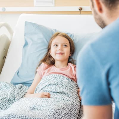 Young patient receiving dialysis treatment.