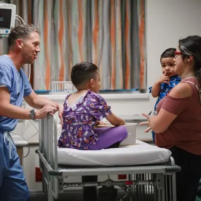 Children's Nebraska provider speaking with mom of a young patient.
