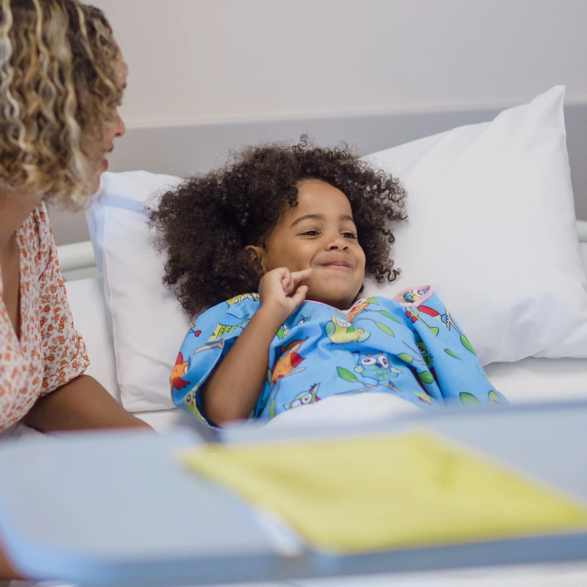 Young child in a hospital bed.