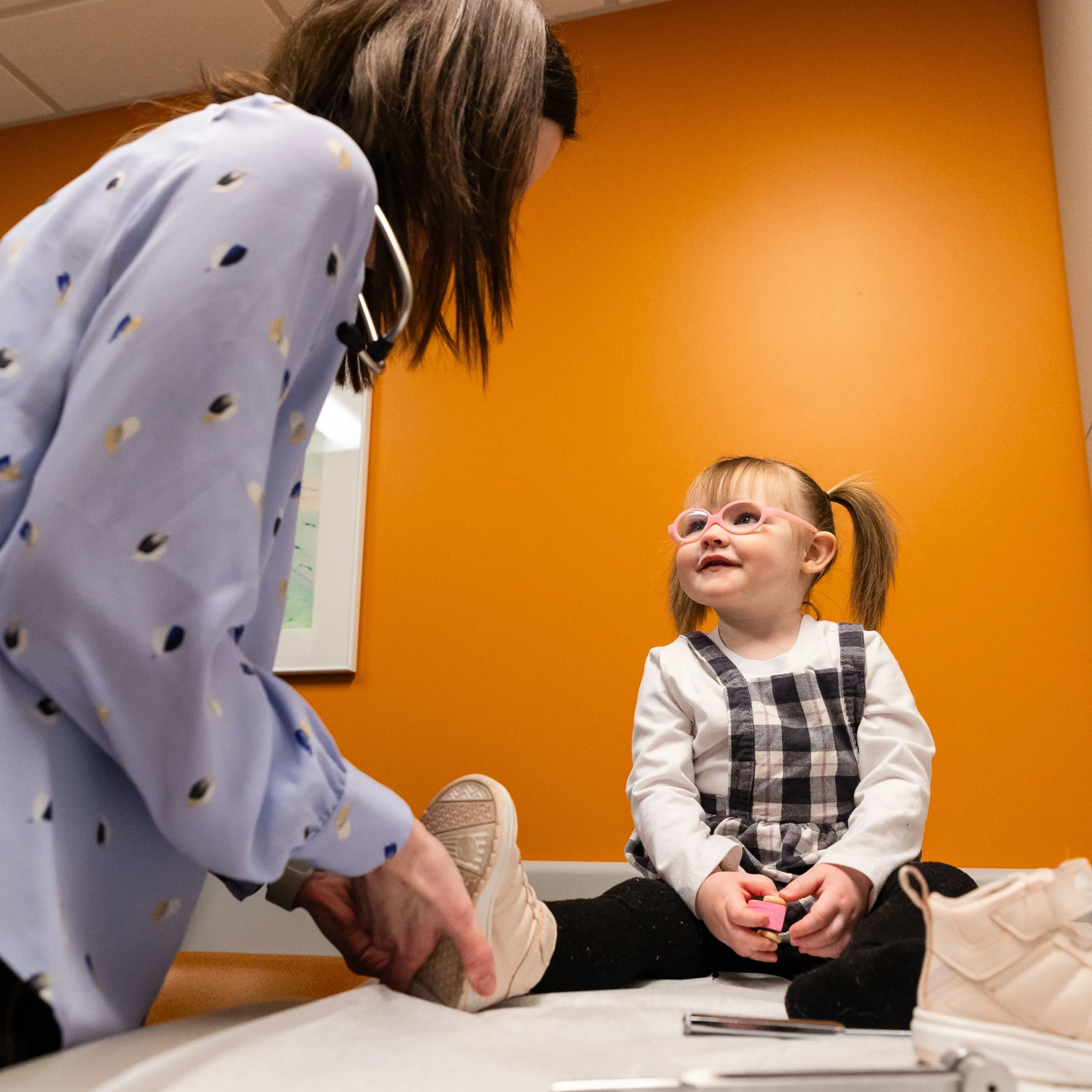 Provider working with young patient in the Epilepsy Center.