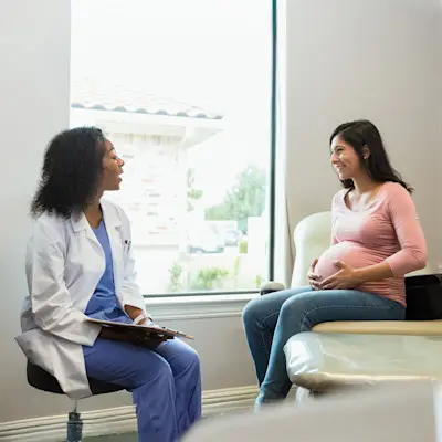 Provider speaking with expectant mother.