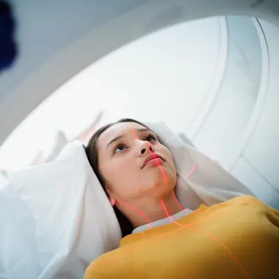 Teen patient lined up for CT scan.