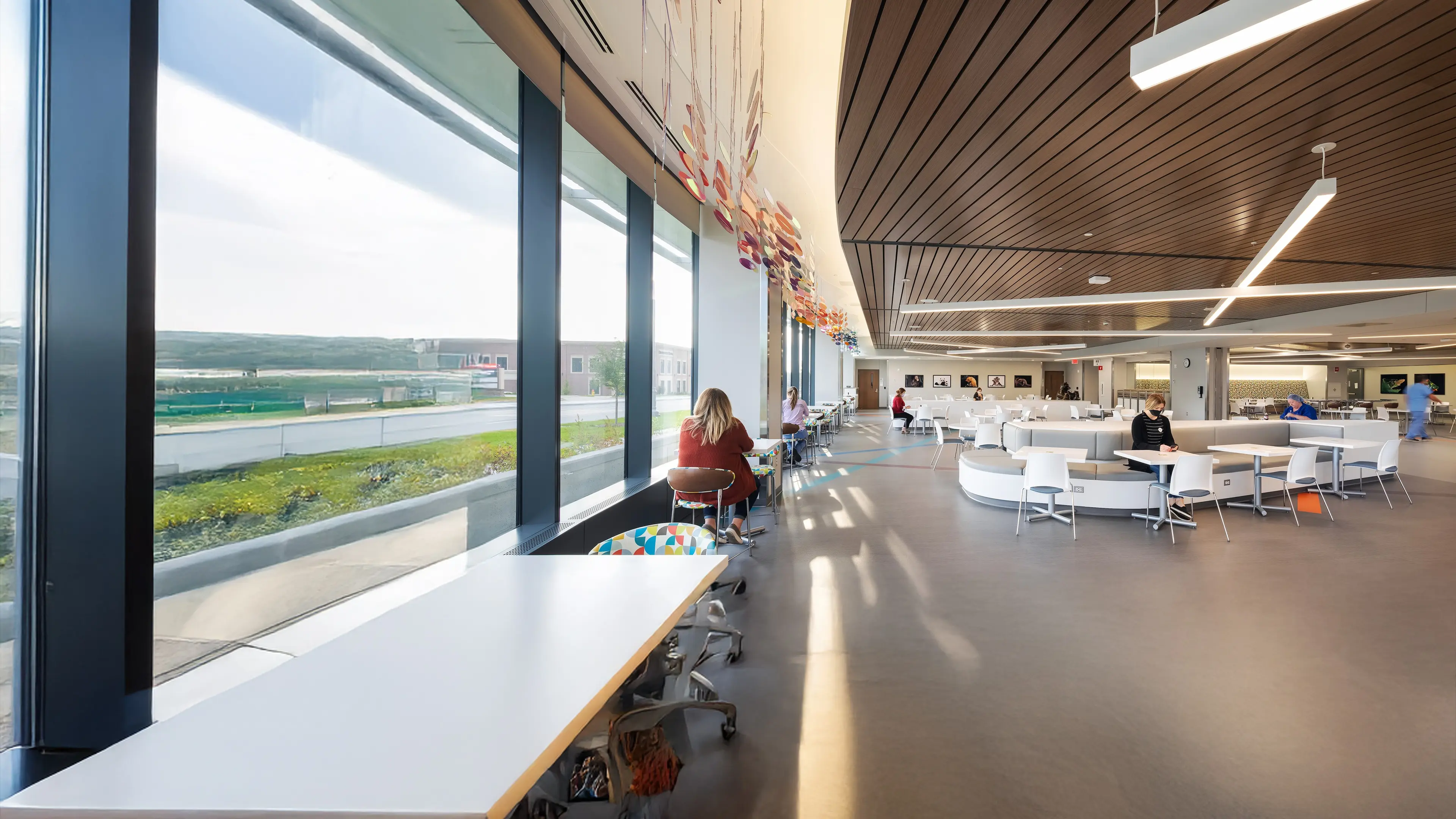 Patients, families and Children's team members enjoying a meal in the Children's Nebraska cafeteria.