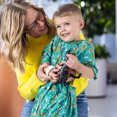 Mother making child smile.