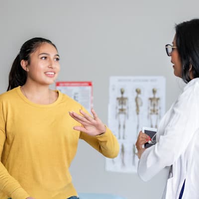 Teen girl talking to provider.