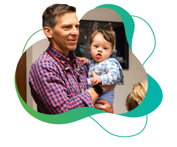David "Trey" Jantzen III, MD with a young patient.