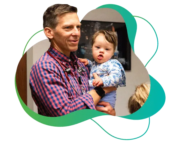 David "Trey" Jantzen III, MD with a young patient.