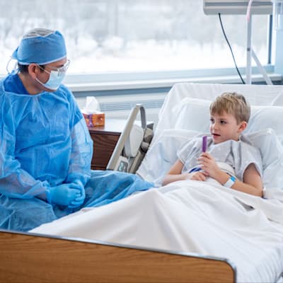 Provider talking to young patient.