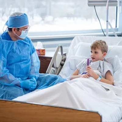 Provider talking to young patient.