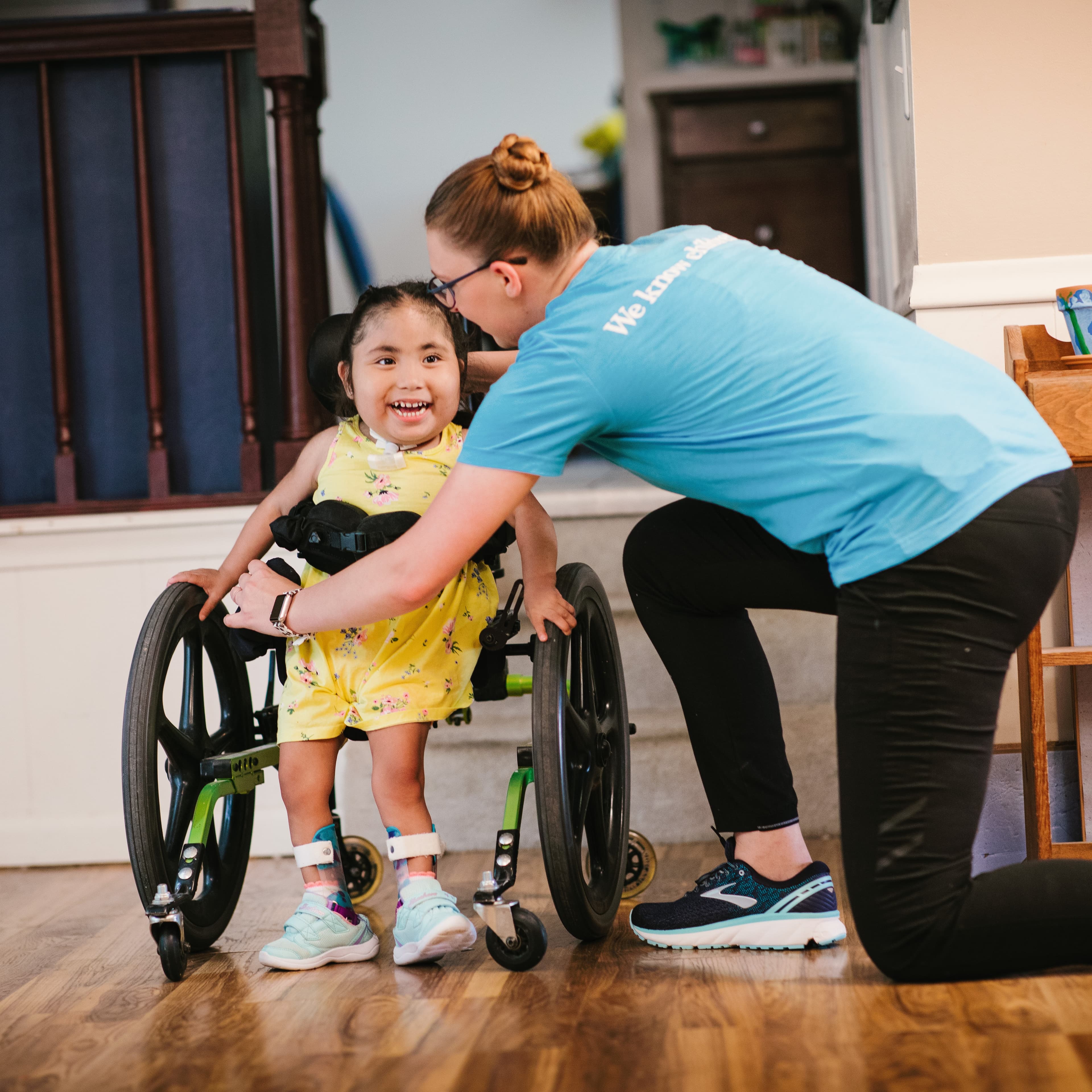 Children's Home Health provider working with young patient in her home.
