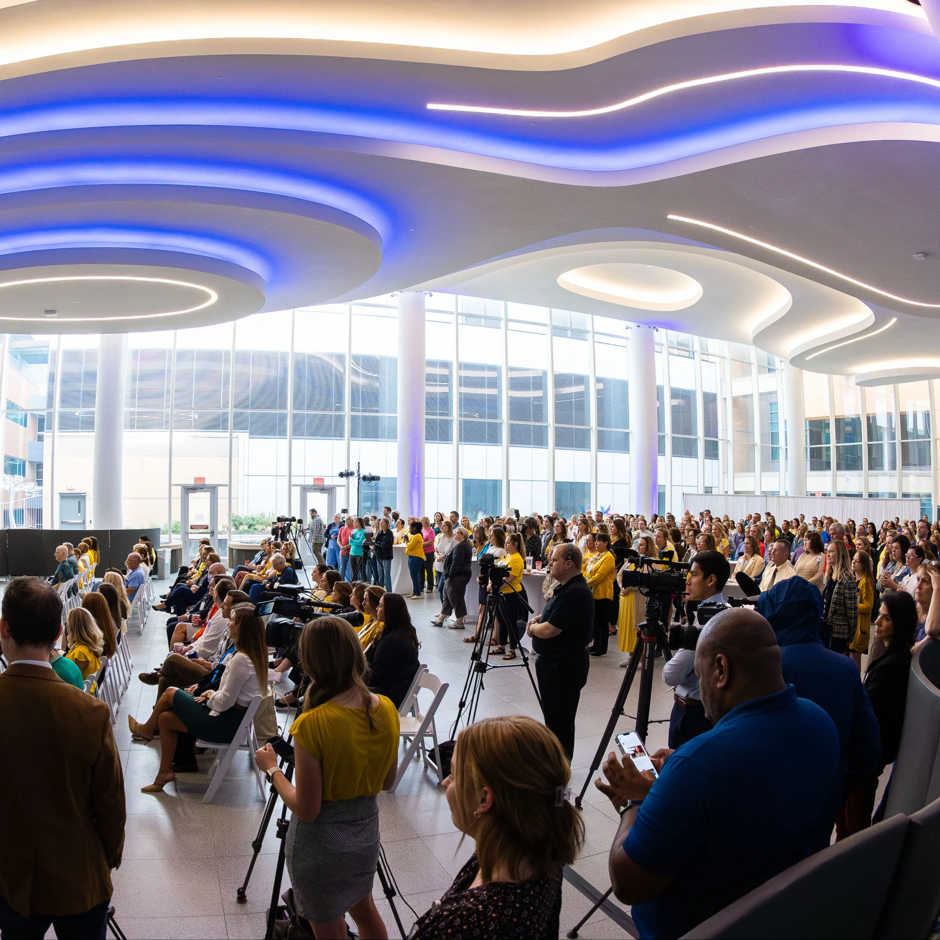 Local media with cameras set up at Children's anniversary event.