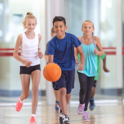 Kids running during gym class.