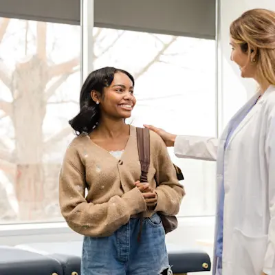 Teenage girl talking to provider.