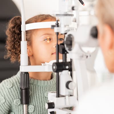Provider examining patient's eyes.