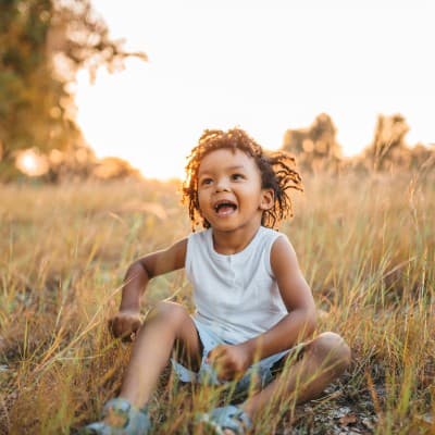 Young child playing outside.