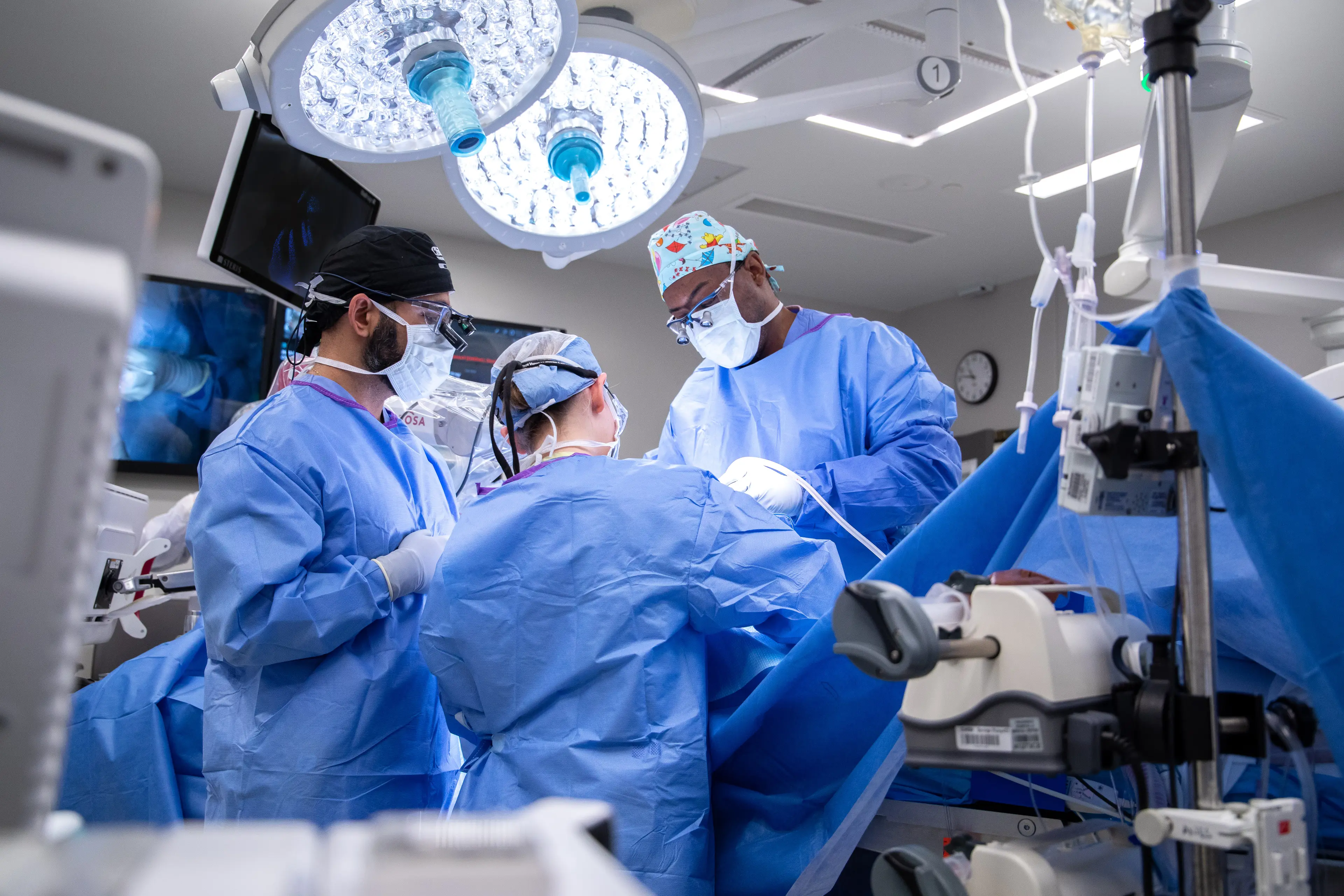 group of physicians working in an operating room