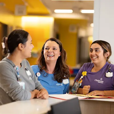 Nurses talking on patient floor.