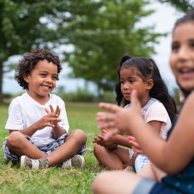 Group of young kids playing outside.