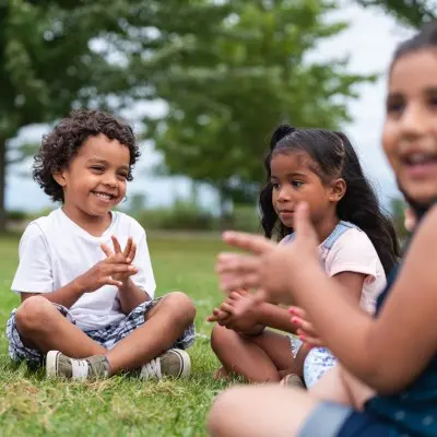 Group of young kids playing outside.