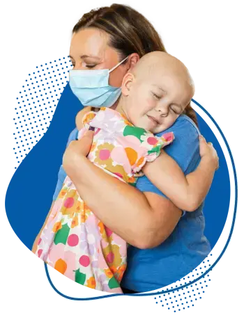 Children's provider hugging young cancer patient.