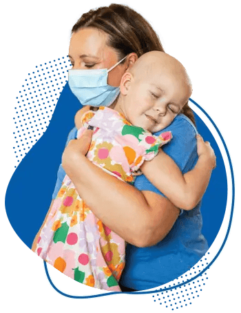 Children's provider hugging young cancer patient.