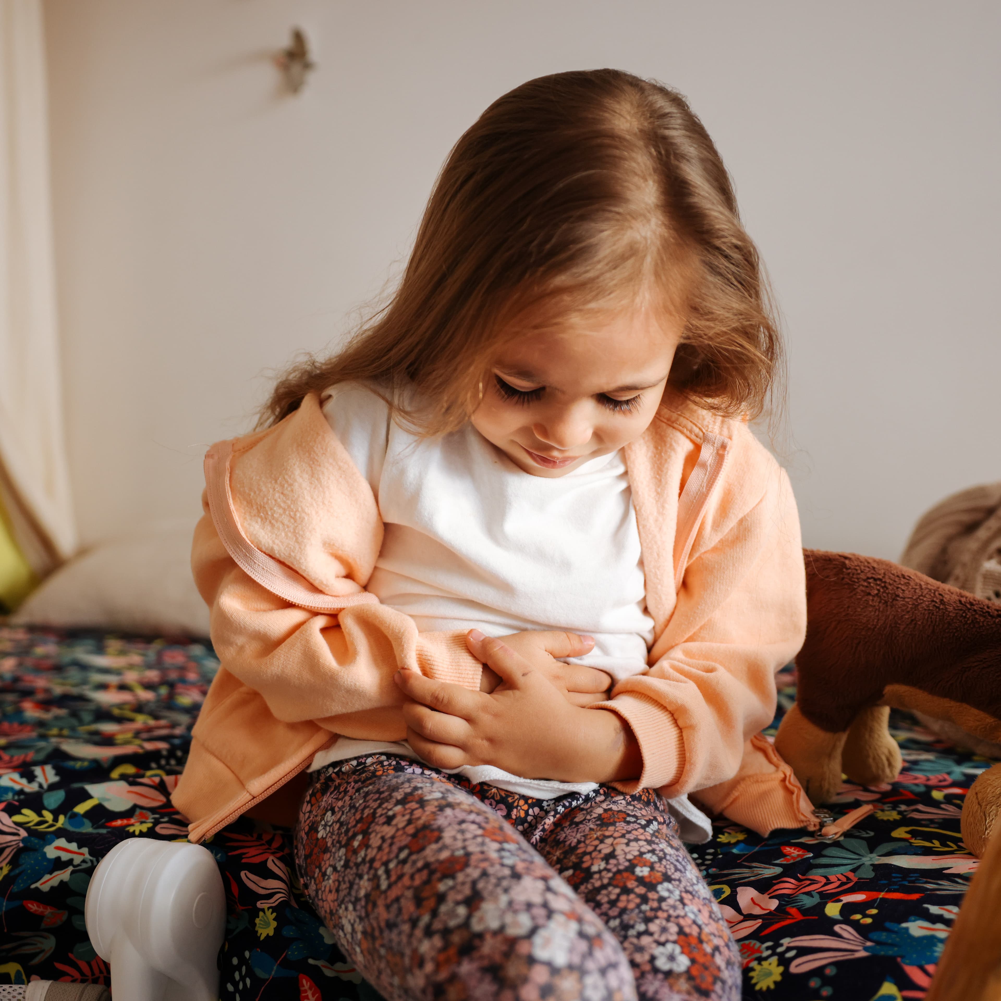 Young girl with stomach ache.
