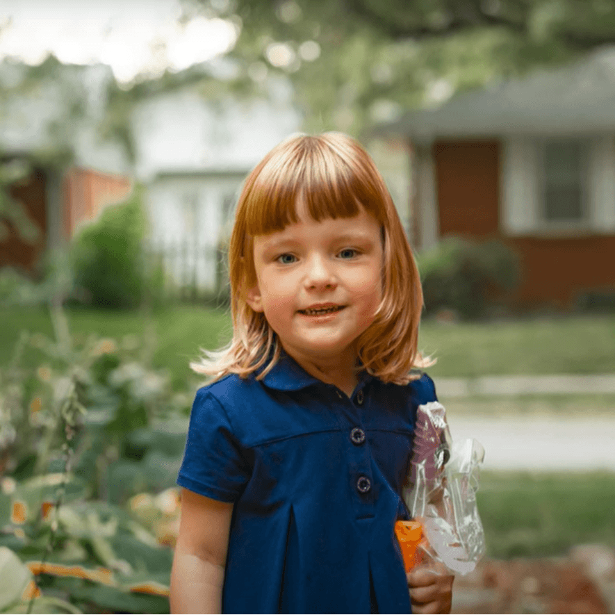 Marly, a Children's Nebraska patient, smiling outside.