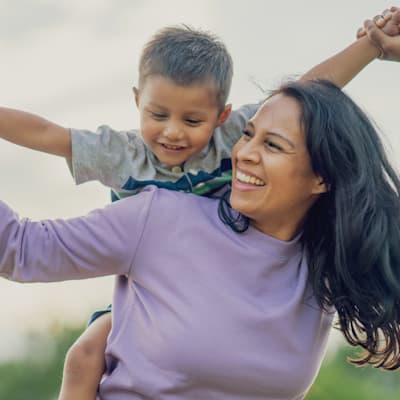 Mother playing with happy child.
