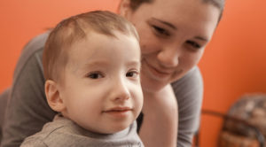 photo of boy with caregiver