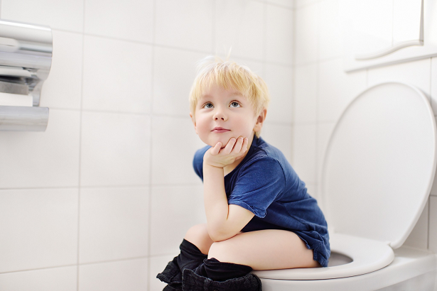 photo of child sitting on potty