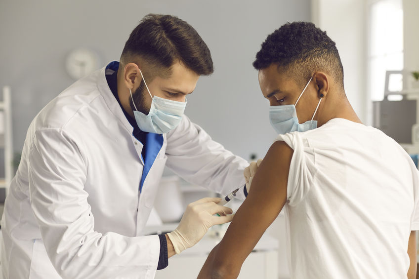 Teen getting a vaccine